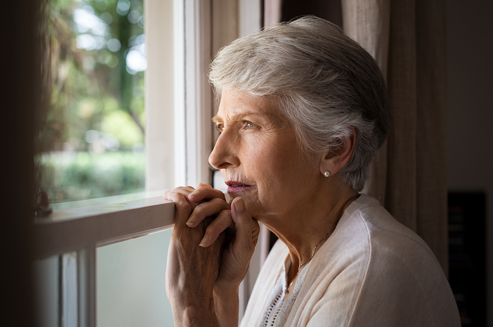 woman looking out window